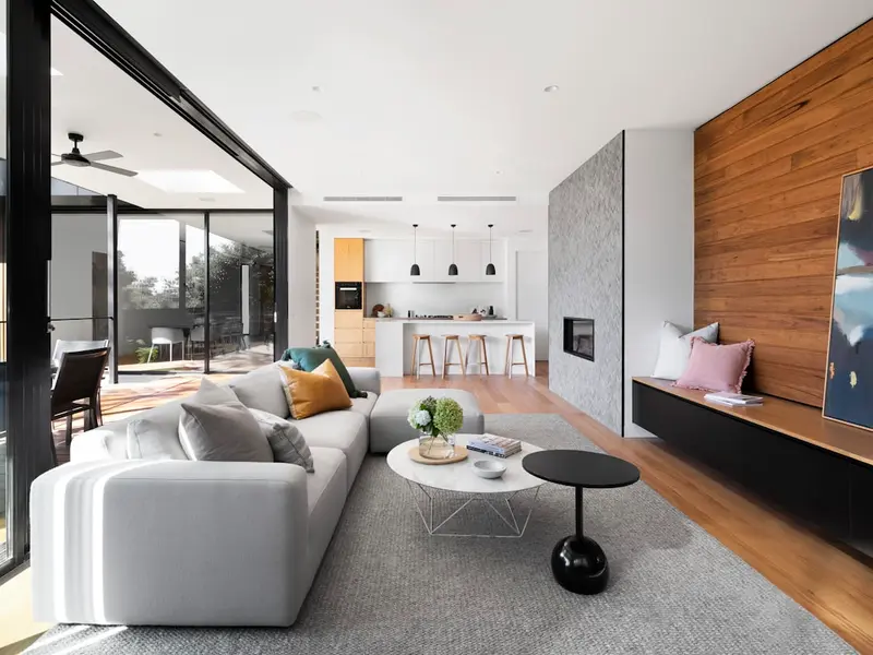 Modern architectural home with large windows and evening lighting